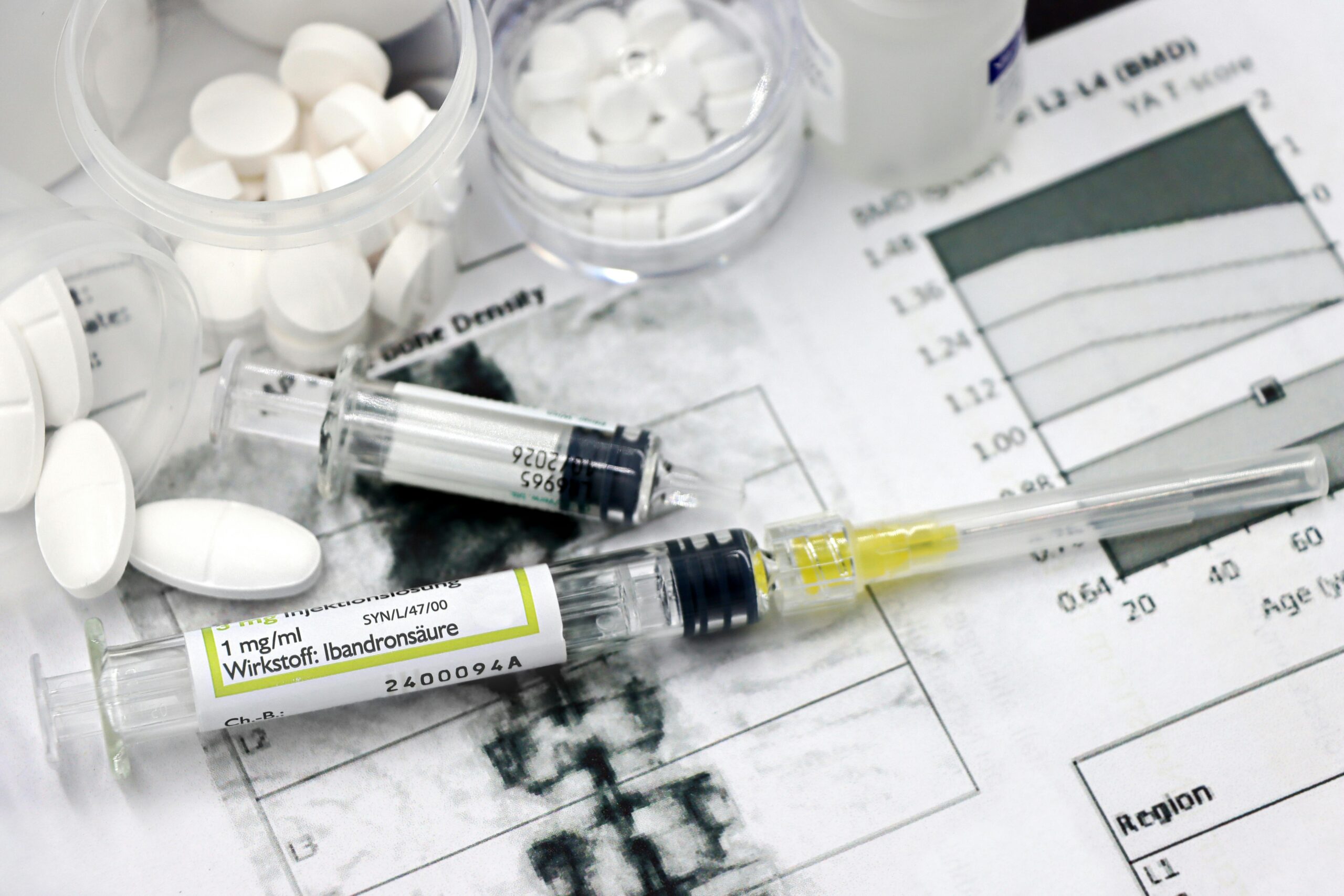 Medical arrangement of osteoporosis treatment tools with injections and pills.